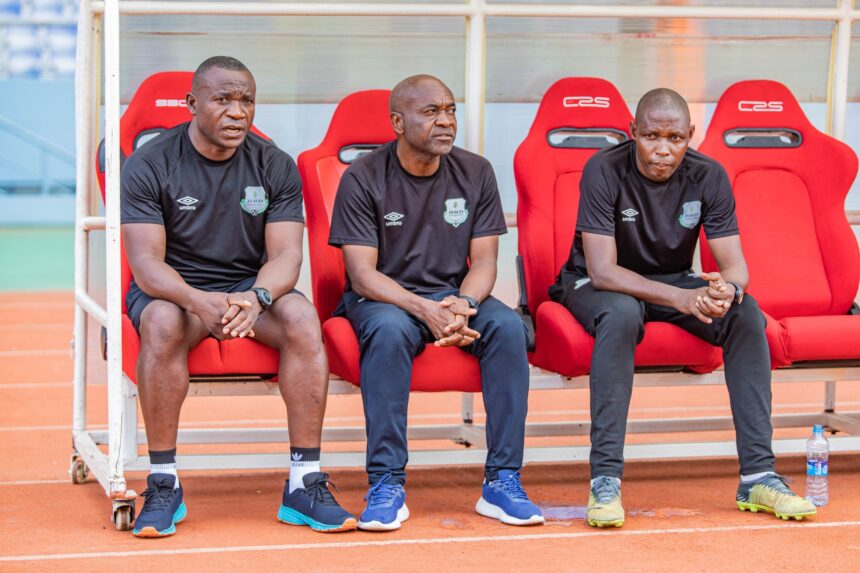 Zesco interim coach Emmanuel Siwale [in the middle] with his assistants. (Photo via Zesco United FC media)