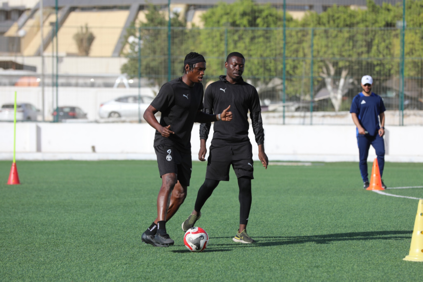 Kelvin Kampamba (on the right) during training in Libya with his Al Madina teammate. (Photo via Al Madina media)