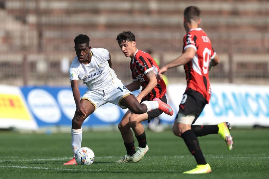 Milan, Italy. 9th Apr, 2025. Filippo Scotti of AC Milan looks on as team mate Emanuele Sala challenges Joseph Liteta of Cagliari Calcio during the Coppa Italia match at Arena Civica Gianni Brera, Milan. Picture credit should read: Jonathan Moscrop/Sportimage (Photo via Sportimage Ltd/Alamy Live News)