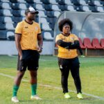 Assistant coach Cosmas Kabaza keeping tabs on proceedings alongside head coach Carol Kanyemba. (Photo via FAZ media)