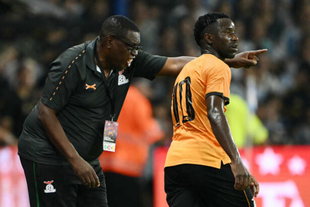Zambia's head coach Moses Sichone gives instructions to forward Fashion Sakala during a friendly football match between Argentina and Zambia at La Bombonera stadium in Buenos Aires on March 31, 2026. (Photo by Luis ROBAYO / AFP via Getty Images)