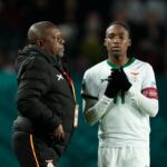 Bruce Mwape head coach of Zambia and Banda Barbra of Zambia and Shanghai Shengli talk during the FIFA Women's World Cup Australia & New Zealand 2023 Group E match between USA and Netherlands at Wellington Regional Stadium on July 27, 2023 in Wellington, New Zealand. (Photo by Jose Breton/Pics Action/NurPhoto via Getty Images)