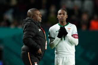 Bruce Mwape head coach of Zambia and Banda Barbra of Zambia and Shanghai Shengli talk during the FIFA Women's World Cup Australia & New Zealand 2023 Group E match between USA and Netherlands at Wellington Regional Stadium on July 27, 2023 in Wellington, New Zealand. (Photo by Jose Breton/Pics Action/NurPhoto via Getty Images)