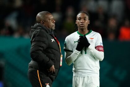 Bruce Mwape head coach of Zambia and Banda Barbra of Zambia and Shanghai Shengli talk during the FIFA Women's World Cup Australia & New Zealand 2023 Group E match between USA and Netherlands at Wellington Regional Stadium on July 27, 2023 in Wellington, New Zealand. (Photo by Jose Breton/Pics Action/NurPhoto via Getty Images)