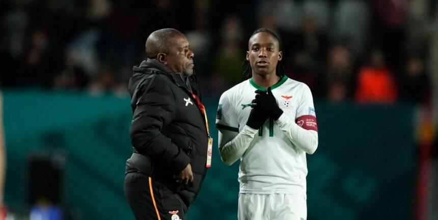 Bruce Mwape head coach of Zambia and Banda Barbra of Zambia and Shanghai Shengli talk during the FIFA Women's World Cup Australia & New Zealand 2023 Group E match between USA and Netherlands at Wellington Regional Stadium on July 27, 2023 in Wellington, New Zealand. (Photo by Jose Breton/Pics Action/NurPhoto via Getty Images)
