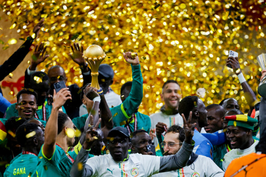 Senegal's team members celebrate with the trophy after winning the Africa Cup of Nations (CAN) final football match against Morocco at the Prince Moulay Abdellah Stadium in Rabat on January 18, 2026. (Photo by Abdel Majid BZIOUAT / AFP via Getty Images)