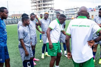 Mwenya Chipepo with Zesco United players. (Photo via ZUFC media)